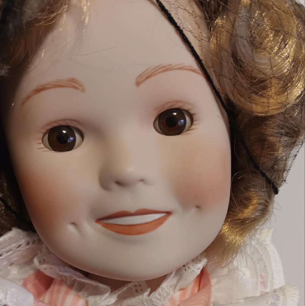 Vintage Shirley Temple all porcelain Doll.